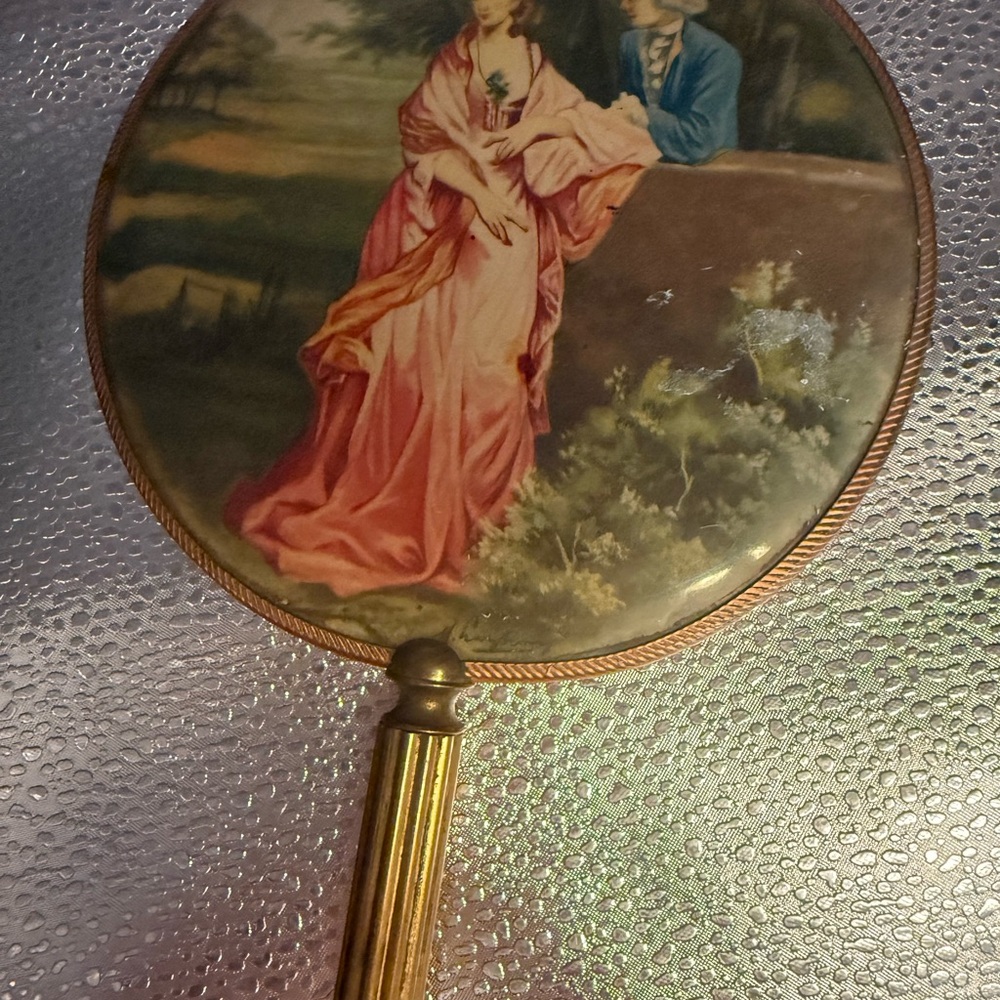 Vintage Handheld Mirror With Romantic Scene